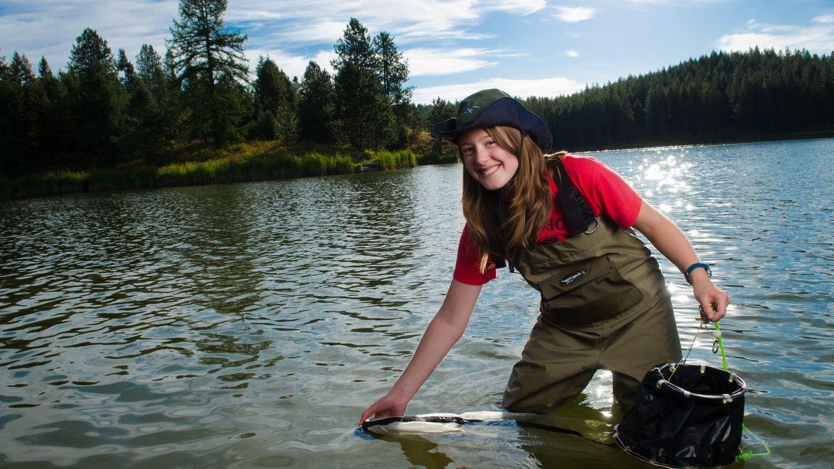 Fish and wildlife student Amy Thorp gathers samples from the Spring Valley Resevoir.